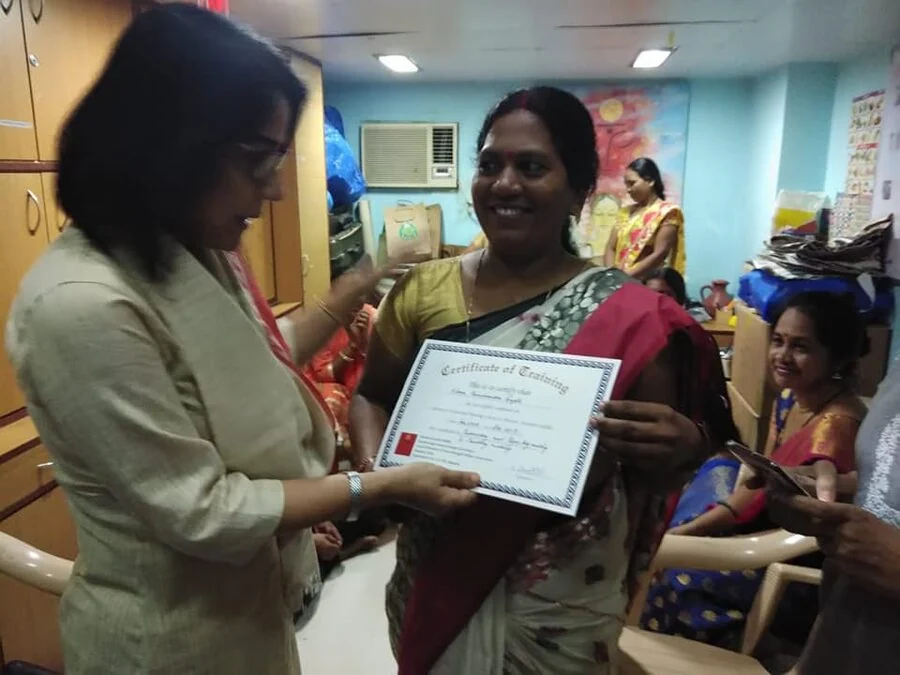 MSS trainer receiving her certificate of training