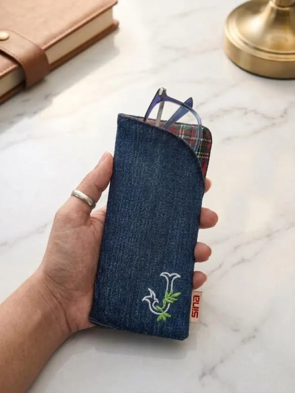 Denim spectacle case with an embroidered flower