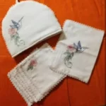 Hand-embroidered hummingbird tea cosy, tray mat and napkins from Mission Swayam Siddha