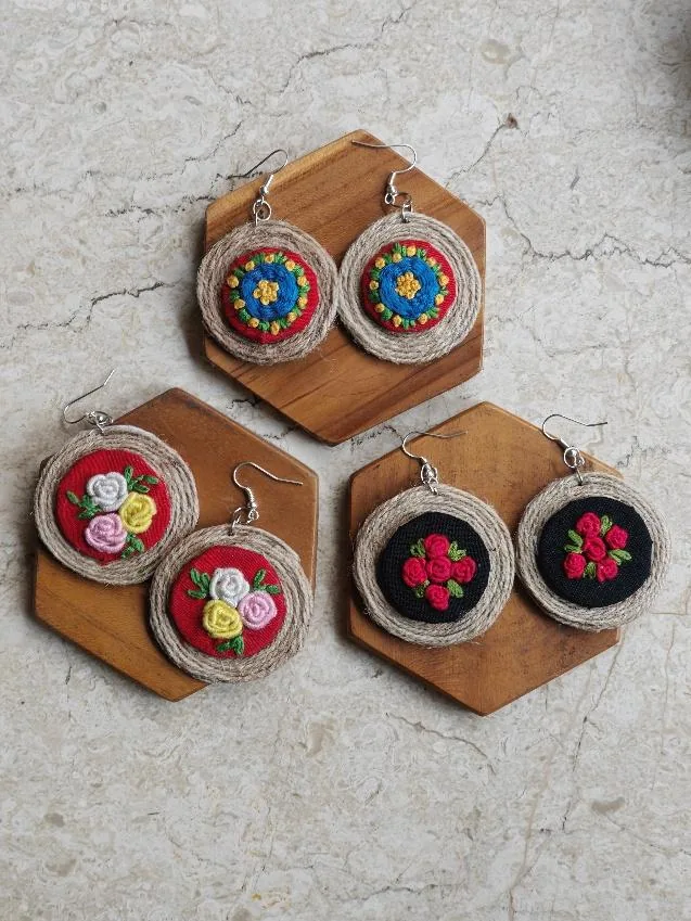 Round earrings with embroidered roses and jute rims