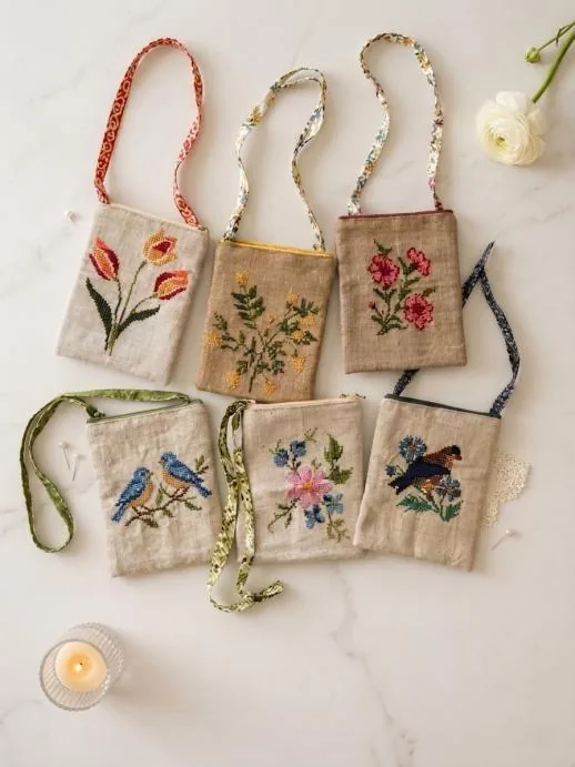 Mobile sling bags embroidered with birds and flowers