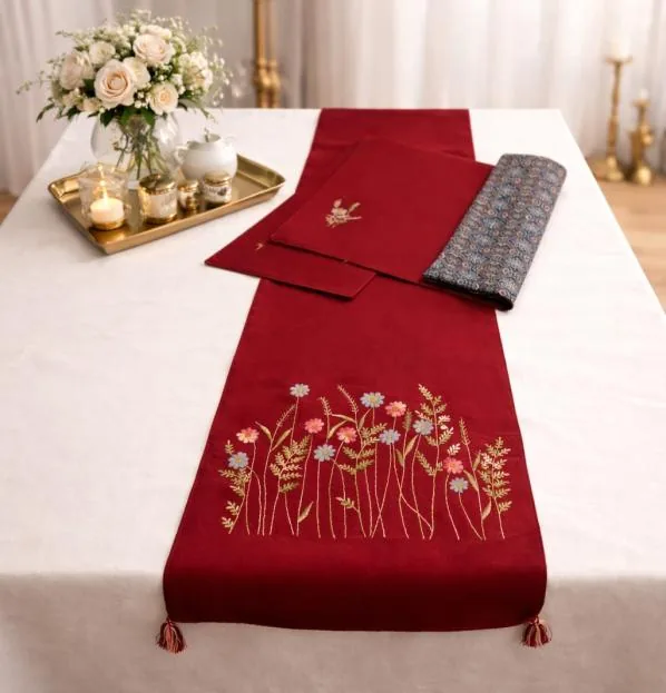 Red table runner hand embroidered with wildflowers