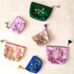Silk coin pouches with hand-embroidered flowers