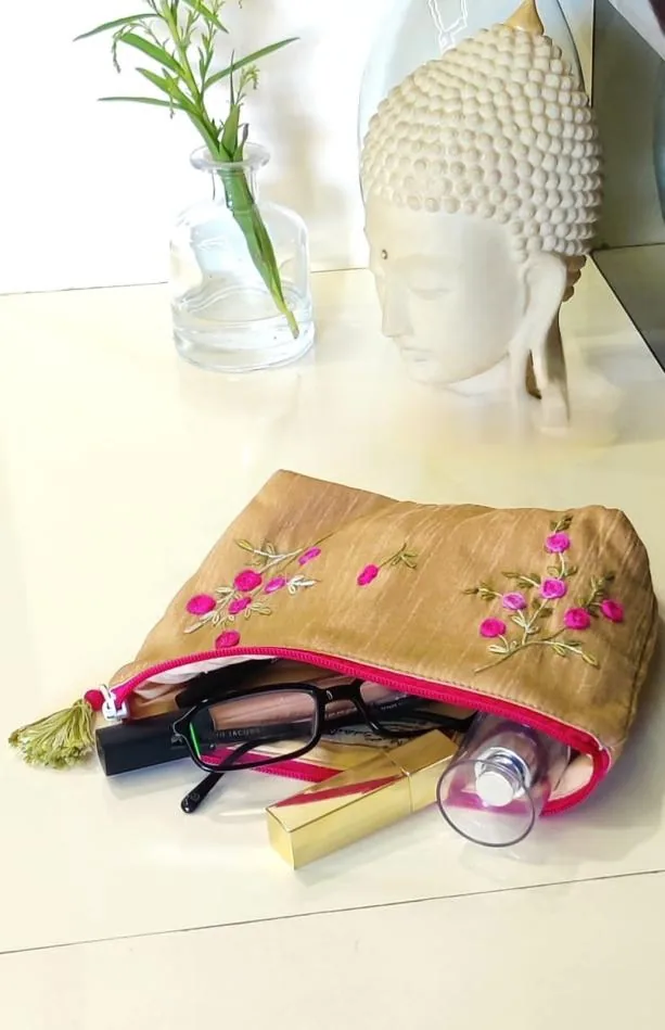 Gold silk pouch hand embroidered with pink flowers