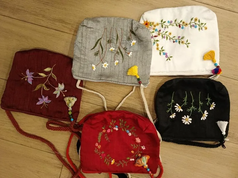 Silk sling bags hand embroidered with flowers