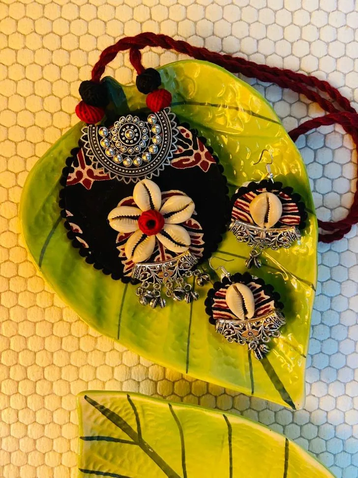 Fabric necklace and earring set with cowrie shells