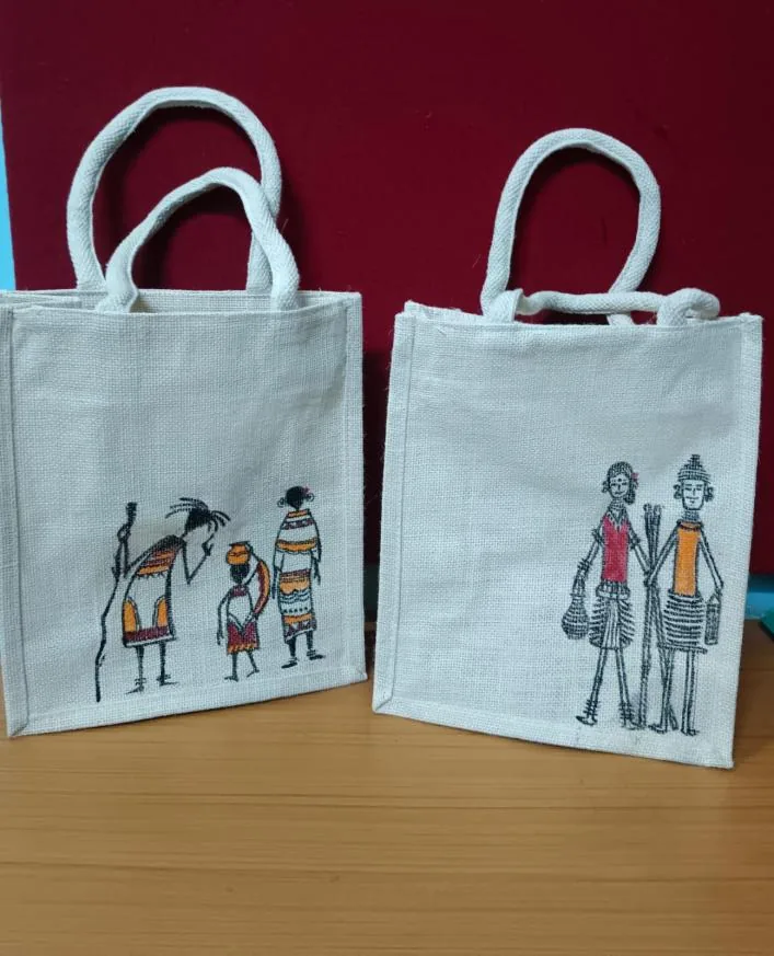 White jute tote bags hand painted with tribal figures