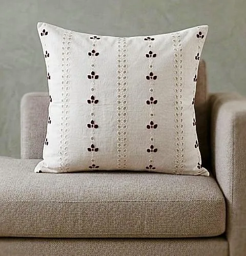 White cushion cover with cutwork embroidery